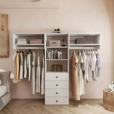 an organized closet with clothes hanging on the shelves, drawers and other items in it