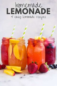 three mason jars filled with homemade lemonade and fruit