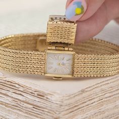 We love a jewel that is both beautiful and functional! We love how this mesh bracelet appears like any other bracelet out there but a quick flip of the lid opens to reveal a slender watch underneath. Chic, elegant, and a perfect addition to any jewelry wardrobe. 14kt yellow gold, 6.7” in length, 24.9 pennyweights.Diamonds are estimated H/I colors, VS clarities, GIA standards.Please see qualitative report for more information. Luxury Vintage Jewelry And Watches With Polished Finish, Luxury Vintage Watch For Anniversary, Elegant Yellow Gold Watch Accessories With Jubilee Bracelet, Elegant Yellow Gold Jubilee Watch Bracelet, Timeless Self-winding Evening Watch, Elegant Formal Watch Accessories: Jubilee Bracelet, Elegant Yellow Gold Self-winding Watch, Elegant Gold Self-winding Watches, Luxury Wedding Jewelry And Watches With Jubilee Bracelet