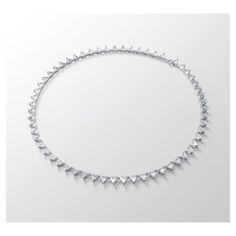 This necklace is precision-engineered from a uniform row of triangle step-cut clear stones. It is set on a silver tone plated fluid chain that is finished with a small lobster clasp fastening. A piece to keep and wear forever, this is your new go-to necklace for timeless elegance day or night. This necklace is part of the Millenia family, designed by Creative Director Giovanna Engelbert for Collection I.Dimensions: Length: 14 7/8 inchesPlating: Rhodium platedcolor: White Swarovski Millenia, Step Cut, Clear Stone, Creative Director, Rhodium Plated, Lobster Clasp, Sale Items, Timeless Elegance, Diamond Necklace