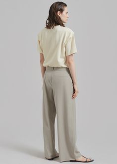 Color: Beige Classic woven suiting material Regular fit Straight leg Mid rise Slant hip pockets Back welted pockets Hook and bar closure Zip fly Unlined 59% Polyester 26% Rayon 15% Wool Dry Clean By The Frankie Shop. Imported The Frankie Shop, Frankie Shop, Womens Bottoms, Mid Rise, Straight Leg, Dry Clean, Trousers, Wool, Bar