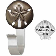 an image of a blue sand dollar on a metal hook with the sealife cabinet knobs com logo below it