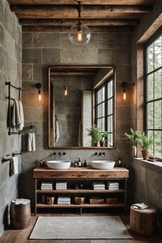 a rustic bathroom with two sinks and a large mirror above the sink is surrounded by wood planked walls