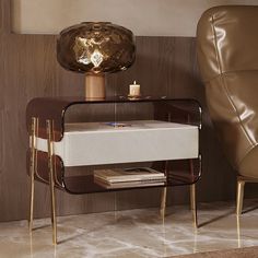 a modern side table with a magazine rack on it and a leather chair in the background