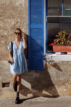 The perfect all-round dress for your sunchasing adventures! This cute babydoll dress with side pockets is our absolute bestseller, you will live in it! Crafted from the softest linen and designed in a flowy cut, it keeps you cool even in hot climates. • 100% French flax linen• Button-down front, can be unbuttoned• Side pockets Our fabrics are pre-washed and your ROVE piece will soften over time. ⌵ Sizing Chart & Guide Choose the size that best matches your measurements on our sizing chart. The d Baby Blue Summer Dress, Blue Summer Dress, Blue Summer Dresses, Warm Red, Pure Linen, Babydoll Dress, Powder Blue, In Hot, Short Tops