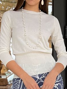 This soft and luxurious women’s Silk-Cashmere Hi-Rib Crew by Kinross is the perfect layer to wear next to your skin to provide you with optimal comfort year-round. Her ribbed knit waist is long enough to tuck in or be worn outside, fitting your hips with perfection. With a classic style in soft ivory, flattering three-quarter sleeves and ribbed cuffs. Undeniably elegant.Fabric: 85% Silk, 15% Cashmere – 2ply / 9ggModel is shown with: Sorrento Pants, Brookie glass-bead necklace in cream, Cuba Tear Elegant Crew Neck Knit Top With Ribbed Cuffs, Elegant Cashmere Tops With Ribbed Cuffs, Winter Cashmere Tops With Ribbed Cuffs, Stretch Cashmere Tops With Ribbed Cuffs, High Neck Cashmere Tops With Ribbed Cuffs, Hand Beaded Bag, Business Outfits Women, Quarter Sleeve, Glass Bead Necklace