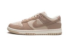 The Women’s Nike Dunk Low “Sanddrift” is a women’s-exclusive colorway of the vintage basketball shoe that features a versatile appearance.  The “Sanddrift” Dunk Low is complete with a light tan leather base with contrasting dark tan suede overlays and Swoosh branding.  Tonal “Nike” detailing is embroidered onto the heel.  Additional “Nike” branding can be found on the tongue tag.  A Sail midsole and Sanddrift rubber outsole put the finishing touches on the design.  Release date: March 4, 2023 Womens Dunk Low, Wmns Dunk Low, Shoe Palace, Retro Basketball Shoes, Nike Branding, Preppy Shoes, Vintage Basketball, Streetwear Accessories, Nike Brand