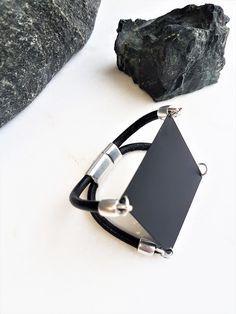 "Women's black square bracelet, black metal sharp cuff bracelet, edgy-rock style bracelet, geometric black jewelry, statement cuff, women's gift Welcome to my shop! ✈️ DHL EXPRESS SHIPPING AVAILABLE, 1-3 BUSINESS DAYS DELIVERY! ✔️ PLEASE MAKE SURE TO SELECT IT, RIGHT BEFORE YOUR PURCHASE! ❗️ ❗️ DON'T FORGET TO ADD YOUR CELL # AT THE \"NOTE TO SELLER\" SECTION IF YOU CHOOSE DHL! BY FILLING YOUR CELL NUMBER YOU EARN THE BENEFIT TO CHOOSE BETWEEN 6 DIFFERENT DELIVERY OPTIONS! INSTRUCTIONS WILL BE S Adjustable Matte Black Modern Jewelry, Modern Matte Black Adjustable Jewelry, Edgy Black Metal Cuff Bracelet, Black Metal Minimalist Cuff Bracelet, Black Minimalist Metal Cuff Bracelet, Minimalist Black Metal Cuff Bracelet, Modern Black Rectangular Leather Bracelet, Modern Adjustable Black Jewelry, Modern Metal Jewelry With Black Band