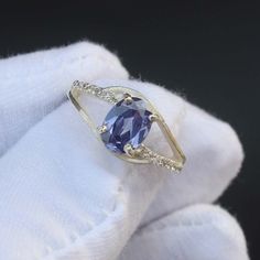 Handmade Product Description Gemstone : Lab Tanzanite Stone Size : 6X8 MM Stone Shape : Oval Secondary Stone : Cubic Zirconia Faceted/cab : Faceted Ring Size : All Size Available Band Color : Silver Made In (INDIA) Payment Policy We accept payment through PayPal Payment should be made within 3 days of purchase. Delivery Time It is Handmade Item So Item will be Shipped within 3 to 5 Days after payment receive. The delivery time usually takes 11 to 24 days, depending which Country & location. We r Purple Sapphire Oval Ring, Oval Purple Sapphire Rings, Tanzanite Oval Birthstone Promise Ring, Oval Tanzanite Birthstone Promise Ring, Oval Topaz Anniversary Ring With Stones, Oval Tanzanite Birthstone Ring With Accent Stones, Oval Sapphire Rings For Jewelry Making, Oval Promise Ring With Stones, Oval Sapphire Crystal Ring With Birthstone