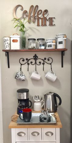 a coffee station with pots and pans on it