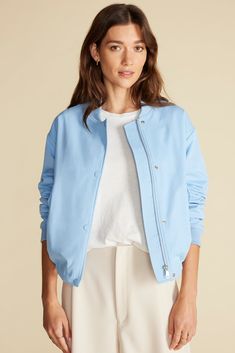 That ideal mix of sporty and sleek, the Jarrel Bomber Jacket works wherever the day takes you. Pair it with jeans and a tee, or drape it over your shoulders with a slip dress for an unexpected twist. DESIGN- Classic fit. Choose your usual size.- Snap-front bomber jacket features long sleeves and hits at the hip with inner adjustable tie at the hem. Fully lined.- Length: 23"FABRIC & CARE- 100% recycled polyester shell- Lining: 100% recycled polyester- Rib: 94% viscose 5% nylon 1% Spandex- Ethical Sweater Blazer, Jumpsuit Skirt, Sweater Sale, Denim Pant, Jacket Sale, Cardigan Jacket, Blouse Dress, Outerwear Jackets, Fabric Care