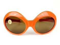 SUPERSOLFLEX original 60s womens sunglasses, Jackie O Made in Italy Authentic - vintage very rare model Original orange acetate frames Original brown crystal lenses New Old Stock - Never been worn Near Mint condition Width: 150mm Temple length: 140mm Height: 56mm SHIPMENT + All items shipped with tracking number. + Generic case included. Orange Retro Sunglasses For Party, Seventies Sunglasses, 60s Sunglasses Vintage, 1970 Sunglasses, Retro Orange Sunglasses With Polarized Lenses, Retro Orange Polarized Sunglasses, Giant Vintage Sunglasses, Retro Orange Cat Eye Sunglasses, 60s Sunglasses