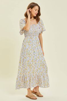 Square neck smocked floral midi dress with flare sleeves and lining.