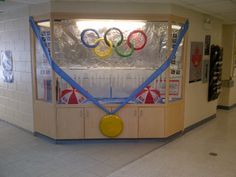 the olympic rings are on display in the building's gym area as well as other sports memorabilia