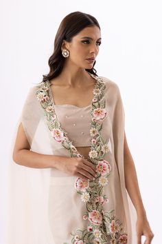 Aina – Sania Maskatiya International Party Dupatta With Floral Embroidery And Cape Sleeves, Bollywood Dresses With Floral Embroidery And Cape Sleeves, Bollywood Style Dresses With Floral Embroidery And Cape Sleeves, Bollywood Style Pearl Embroidery Palazzo Set, Organza Palazzo Set With Traditional Drape, Spring Party Palazzo Set With Sheer Dupatta, Designer Silk Sharara With Cape Sleeves, Elegant Palazzo Set With Floral Embroidery For Reception, Elegant Floral Embroidery Palazzo Set For Reception