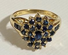 GORGEOUS Vintage 14K Yellow Gold .87 CTW Sapphire Cluster Ring Stunning estate ring with amazing hue blue sapphires! Ring has a .15 ct pear cut Sapphire center stone surrounded by 24 round .03 ct sapphires. .87 CTW! Size 6 Weighs 3.6 grams Please message me with any questions Shipped insured/delivery confirmation I guarantee item to be exactly as described and pictured Luxury Sapphire Cluster Ring With Timeless Style, Luxury Sapphire Ring With Intricate Design For Formal Events, Luxury Blue Sapphire Cluster Ring Gift, Luxury Sapphire Cluster Ring With Center Stone, Luxury Vintage Cluster Sapphire Ring, Luxury Classic Cluster Sapphire Ring, Luxury Handmade Sapphire Ring Fine Jewelry, Luxury Sapphire Ring As Birthstone For Formal Occasions, Quincce Ring Gold And Navy Blue