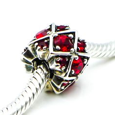 Authentic CHAMILIA Shimmering Stones Red Swarovski Crystal Sterling Silver Charm Bead JB-36C. Compatible with Pandora and Trollbeads. This sterling silver charm with various shapes of red Swarovski Crystals is simply stunning. It will undoubtedly be a statement piece on any charm bracelet. Charm is pre-owned and in great condition. Please view the photos for details, as they are part of the description. Buy with confidence that all my Chamilia items are 100% authentic Chamilia. All precious meta Red Sterling Silver Jewelry With Sparkling Stones, Red Garnet Round Beads Jewelry, Red Spacer Beads Jewelry As Gift, Red Spacer Beads Jewelry Gift, Red Rhinestone Jewelry Gift, Red Round Beaded Stone Jewelry, Red Round Beads Stone Jewelry, Red Jewelry With Round Beads And Stones, Red Garnet Jewelry With Faceted Beads