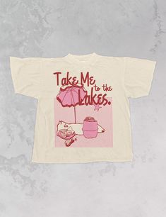 Take Me to the Lakes in our Taylor Swift inspired oversized 70's retro tshirt, perfect for the Era's Tour - Features lyrics from the song "The Lakes" with a picnic graphic in halftone and red and pink ink - Screen print transfer that is heat pressed onto each tshirt - Tshirt is a super soft vintage wash that gets softer after each wash - Oversized fit - Sizing translation: XS/S - L , S/M - XL , L/XL - 2XL , 2XL/3XL - 3XL *due to screens and filters colors may vary slightly to photos* Logos On Shirts, T Shirt Artwork, Tshirt Merch Design, Taylor Swift T Shirt Ideas, Vintage Tshirts 70s, Aesthetic T Shirt Design, Taylor Swift Graphic Tee, Picnic Graphic, Trendy Tshirt Designs