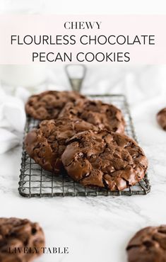 chewy flourless chocolate pecan cookies on a cooling rack