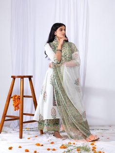 This suit set comes with a double dori neck detailing and a front long panel with borders. Pair it with a matching palazzo and hand-block printed dupatta for a complete elegant look this summer. 100% Premium Cotton Printed Suit Set Hand-block Printed Dupatta Comfort fit Set Contents: 1 Kurta, 1 Dupatta, 1 Palazzo Model height is 5.7 feet and is wearing size M Wash Care Instructions: Dry Clean Only Note: The product will be delivered within 15-20 days of the order placed. The product can be made Block Print Mulmul Sharara With Straight Kurta, Anarkali Lawn Suit With Block Print, Designer Cotton Palazzo Set With Sheer Dupatta, Chanderi Sharara With Block Print Straight Kurta, Cotton Palazzo Set With Sheer Dupatta For Navratri, Bollywood Style Chanderi Sharara With Block Print, Festive Block Print Lawn Suit For Wedding, Eid Mulmul Sharara With Block Print, Eid Block Print Mulmul Sharara