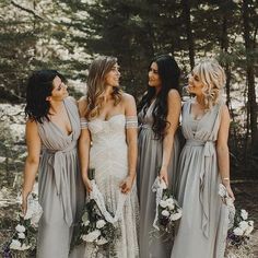 bridesmaids laughing together in the woods