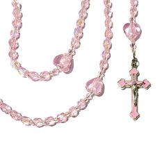 A small, handmade, 5 decade, Catholic rosary. Accented with Miyuki, silver-lined crystal AB seed beads and, pink, faceted, bicone glass beads.AVE (Hail Mary Beads): 6 mm, Czech, crystal pink shimmer AB, round, faceted glass beadsPATER (Our Father Beads): 12 x 14 mm, pink glass heartsCRUCIFIX: Orthodox/byzantine crucifix w/pink enamel, silver oxidized, approx. 1.6", Italian-made, one sided CENTERPIECE: small EucharistLENGTH: 16 1/4 inches Also known as Dominican Rosary and Holy Rosary. Pink Beaded Spiritual Rosary, Pink Spiritual Faceted Beads, Pink Beaded Rosary With Round Beads, Pink Beaded Rosary, Pink Beaded Spiritual Rosary Bracelet, Handmade Pink Spiritual Crystals, Holy Rosary, Catholic Rosary, Our Father