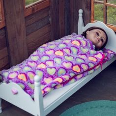 This adorable plush doll-sized sleeping bag is perfect for an overnight adventure with either your 15 inch doll or your 18 inch doll. Soft and cuddly purple plush background with multi colored hearts covers this adorable sleeping bag. Lined in soft purple fabric. Sized to fit 15 inch dolls to 18 inch dolls. Sleeping bag measures 10" W x 19" L. Also available in a pretty pink- sold separately. Exclusively made by The Queen's Treasures, offering the highest quality 18 inch Doll Furniture, 18 inch Play Doll, Kids Toy Shop, Barbie Doll Set, Owl Plush, American Girl Dolls, Doll Play, Soft Purple, Purple Fabric, Patch Kids