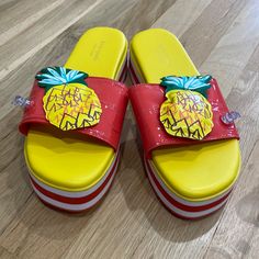 Detailed With Puffy Inflatable Pineapples, These Adorable Platform Sandals Serve As Floaties For Your Feet And Have An Approximately 2 Inch Lift For The Soles Of Your Feet. Slip Them On Between Dips In The Pool Underneath The Summer Sun. Size 9 Never Worn! Completely New Without Box! Playful Plastic Slip-on Sandals, Multicolor Slip-on Slides For Summer, Yellow Fun Slip-on Sandals, Yellow Textured Footbed Slip-on Sandals, Yellow Slip-on Slides With Removable Insole, Kate Spade Sandals, Rubber Flip Flops, Kate Spade Shoes, Leather Thong Sandals