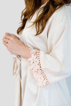 Champagne Elegant Long Sleeve Lace Sleepwear, Elegant Lace Trim Sleepwear For Loungewear, Elegant Beige Sleepwear For Wedding Night, Cream Wedding Robe For Spring, Elegant Satin Sleepwear For Spring, Elegant Long Sleeve Cream Sleepwear, Elegant Delicate Lace Robe For Wedding Night, Feminine Spring Robe For Wedding Night, Cream Wedding Sleepwear With Lace Trim