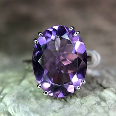 Discover the elegance of our designer natural amethyst ring, crafted in 925 sterling silver. This exquisite piece features a stunning natural amethyst gemstone, renowned for its deep violet hue and spiritual significance. The intricate designer setting showcases the gemstone's beauty while ensuring durability and comfort. Perfect for any occasion, this ring adds a touch of sophistication to your jewelry collection. Whether as a personal treat or a thoughtful gift, this amethyst ring is sure to i Elegant Amethyst Ring For A Gift, Fine Jewelry Amethyst Solitaire Ring, Classic Amethyst Solitaire Ring, Luxury Amethyst Ring Gift, Formal Amethyst Rings With Large Stone, Solitaire Amethyst Ring In Fine Jewelry Style, Elegant Purple Amethyst Ring With Large Stone, Classic Lavender Amethyst Ring, Luxury Purple Amethyst Ring In Sterling Silver