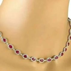 "22 Ct Oval Simulated Red Ruby Women's Tennis Necklace, 14K White Gold Plated, Halo Tennis Women's Necklaces ✤Details✤ Handmade item Ships from a small business in India Metal : Yellow Gold, Rose Gold, White/Silver Gold Finish Gemstone: Cubic Zirconia Gem color: Red Plating color: White  Style: Art Deco  Can be personalized Made to Order ✤Description✤ The most unique jewelry you can find, the perfect gift for you and your loved one.It Is Simulated Gemstone & Diamond And The Cut Of The Stone Is Excellent. The Product Is Available In All Types Of Gold Plated Such As White Gold Plated, Yellow Gold Plated, Rose Gold Plated. * Material : High Quality Solid 925 Sterling Silver * Metal Color: White/Yellow/Rose Gold and Made to Order. * Diamond type: Ruby * Diamond Color : Red  * Main Diamonds Cut Ruby Tennis Necklace, Red Oval Diamond Jewelry, Oval Ruby Jewelry With 17 Jewels, Red Oval Fine Jewelry, Fine Red Oval Jewelry, Oval Red Necklace For Anniversary, Elegant Red Oval Ruby Jewelry, Red Oval Necklace For Anniversary, Oval Ruby Necklaces For Anniversary