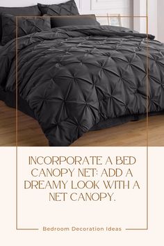 an image of a bed with black comforter and pillows