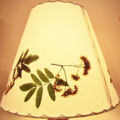 a lamp that has some plants on it