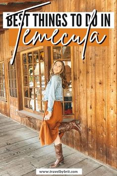 a woman standing in front of a wooden building with the words best things to do in fe