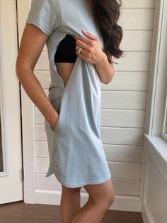 "Our Breastfeeding T-Shirt Dress is the perfect blend of comfort and convenience for breastfeeding mothers. With its breathable cotton fabric, it's perfect for those hot summer days. Zippers on either side provide easy access for breastfeeding, while pockets on the sides add an extra element of practicality. An ideal choice for a relaxed, effortless look that goes beyond style, it's functional! Reference sizing guide before purchasing. Size fits regular in length not tall. For a looser fit (not Nursing Friendly Outfits Fall, Breastfeeding Outfits, Nursing Friendly Outfits, Nursing And Pumping, Breastfeeding Friendly Dresses, Breastfeeding Shirt, Nursing Friendly Dress, Breastfeeding Dress, Pregnancy Clothes