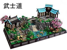 a lego model of a chinese house with flowers and trees in the front, on top of a white background