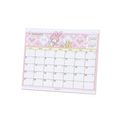 a pink and white calendar with an image of a bunny on the front, sitting in front of a white background