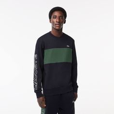 This sweatshirt from Lacoste, sportswear creators since 1933, is a lesson in expert design and bold crocodile styling. Made from cotton fleece for comfort, with a colorblock design and contrast details, including bold branding on the sleeve, for style. Sporty Long Sleeve Sweatshirt With Contrast Panels, Sporty Color Block Fleece Sweatshirt, Streetwear Crew Neck Sweatshirt With Contrast Panels, Sporty Crew Neck Sweater With Contrast Color, Sporty Sweatshirt With Contrast Panels For Streetwear, Sporty Sweatshirt With Contrast Panels, Sporty Color Block Sweater For Streetwear, Sports Cotton Color Block Sweatshirt, Casual Sweatshirt With Contrast Panels For Streetwear