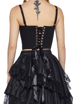 are gonna bring 'em to their knees. Find your new religion in this top that has structured boning, a back lace-up design, adjustable shoulder straps, dangling cross charms, a cropped fit, and a side zipper closure. Black Gothic Corset With Straps, Gothic Corset With Straps, Black Punk Corset With Straps, Black Punk Style Corset With Straps, Gothic Black Tank Top For Party, Gothic Fitted Top With Spaghetti Straps, Fitted Gothic Top With Spaghetti Straps, Gothic Tank Top For Night Out, Gothic Crop Top For Festivals