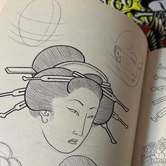 an open book with drawings on the pages and in it's center is a drawing of a woman