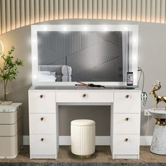 a white vanity with lights on it in a room