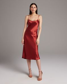 Bias cut Midi Slip Dress elegantly drapes on the body. This perfect basic can be worn for life, dressed up, or dressed down, for the perfect ensemble. Style with a sweater and boots in the Fall or wear with sandals in the Summer. 100% Silk Charmeuse Made in New York City Product Care: Dry Clean Only Backless Halter Dress, Dress Elegantly, Minimalist Outfits, Warm Dresses, Poncho Tops, Convertible Dress, Midi Slip Dress, Silk Tank, Silk Charmeuse