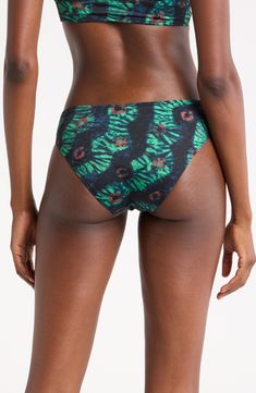 A eye-catching pattern brings sunny flair to these classic hipster bikini bottoms. Moderate back coverage Lined 80% polyamide, 20% elastane Hand wash, dry flat Made in Portugal Printed Tie-side Beachwear Bottoms, Printed Tie-side Bottoms For Pool, Printed Tie-side Pool Bottoms, Beachwear Printed Tie-side Bottoms, Stretch Printed Bottoms For Pool, Stretch Printed Tie-side Bottoms, Tropical Style Printed Tie-side Bottoms, Printed Stretch Bottoms For Poolside, Stretch Printed Bottoms For Poolside