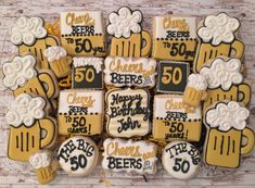 decorated cookies are arranged in the shape of beer mugs with cheers and beers written on them