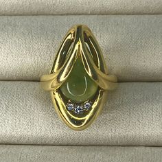 Vintage Grosse Germany 1973 | 14k Gold Ring | Jade Stone With Diamonds | Size 3.5 | Yellow Gold Marquise Emerald Ring, Unique 14k Gold Emerald Ring For Formal Occasions, Formal Marquise Yellow Gold Emerald Ring, Unique 14k Gold Diamond Ring For Formal Occasions, 14k Yellow Gold Pear-shaped Emerald Ring, Pear-shaped Emerald Ring In 14k Yellow Gold, Unique Hallmarked Yellow Gold Emerald Ring, Yellow Gold Cabochon Ring In Fine Jewelry Style, Fine Jewelry Yellow Gold Cabochon Rings