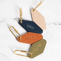 - Embossed Diamond Leather Keychain w/ Gold Key FOB - Includes personalization (up to 8 letters) - 4 leather colors to choose from - Terracotta, Navy, Matcha, Cream - 4 foil embossing options - Blind Embossing (No Color), Gold, Rose Gold, Silver - Production takes approx. 3-5 business days & shipping speed can be selected upon checkout Our Hand-Embossed Leather Keychain is uniquely shaped in an elegant diamond design and paired with a stunning Gold Key FOB. Choose from a palette of five distinct leather colors to match your style, and further customize with a choice of blind embossing, gold, silver, or rose gold foil for a truly individualized key chain. Luxury Key Chains, Matcha Cream, Foil Embossing, Blind Embossing, Custom Cufflinks, Planner Business, Leather Colors, Hanger Design, Keychain Fob