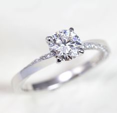 a diamond ring on a white background