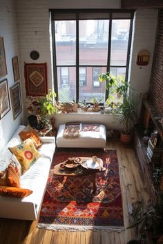 a living room filled with furniture and lots of windows