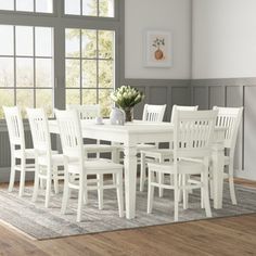 a white table and chairs in a room