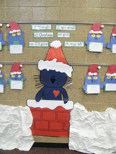 a bulletin board decorated with santa hats and paper cutouts on it's sides